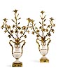 A very fine pair of Louis XVI gilt bronze mounted white marble three-light candelabra